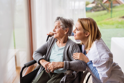 a young and old woman watching outside